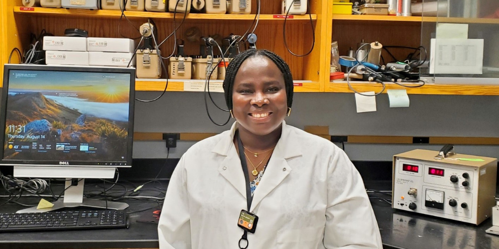 Isata Sesay standing in a lab