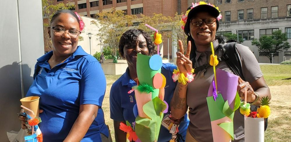 three EVS employees at event