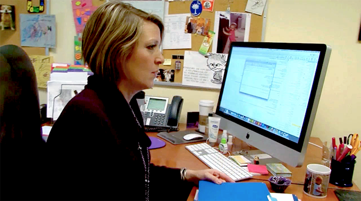 A woman working at her computer