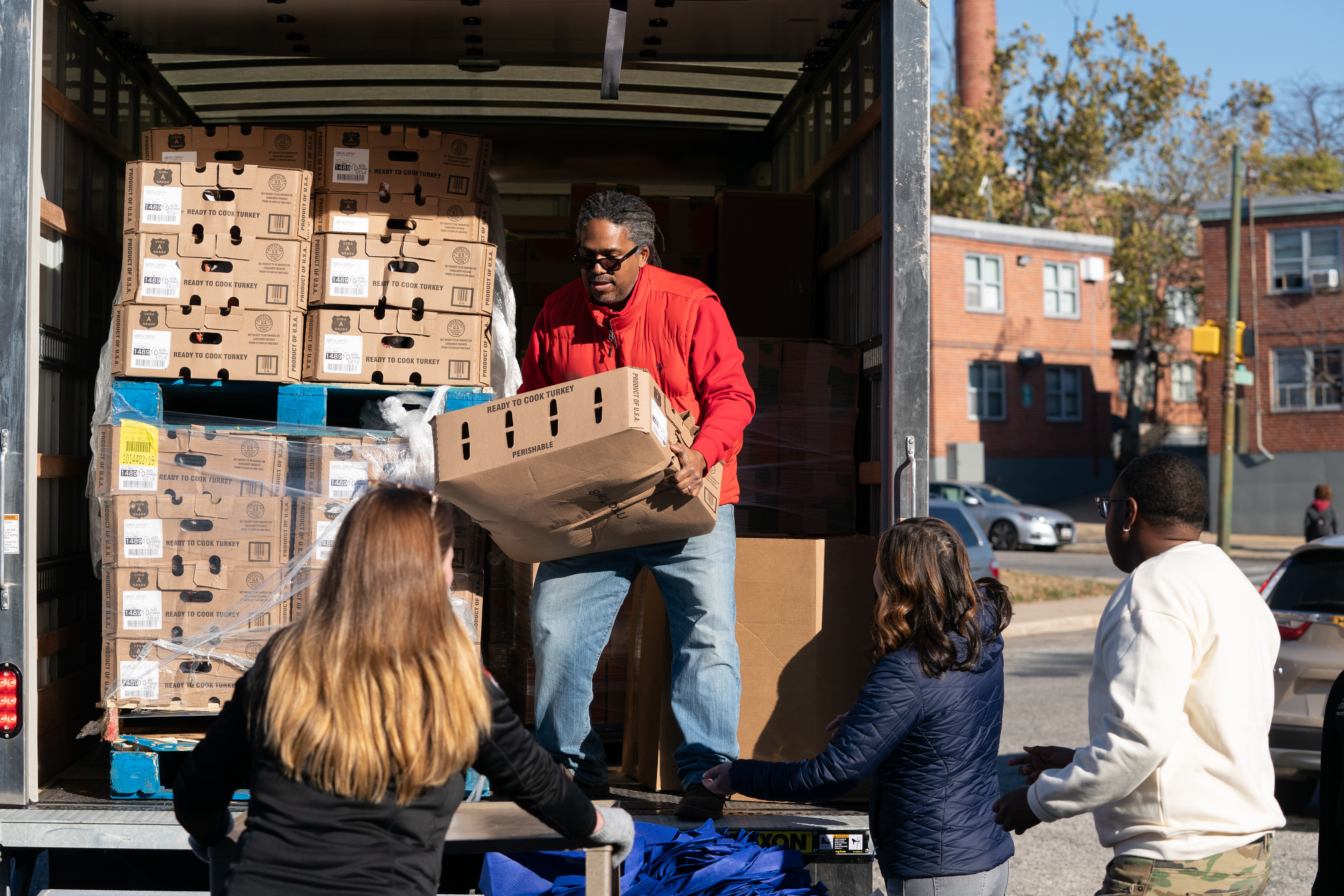 People unloading the truck for the turkey drive