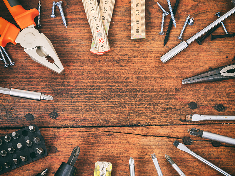 Hand tools on a wooden table
