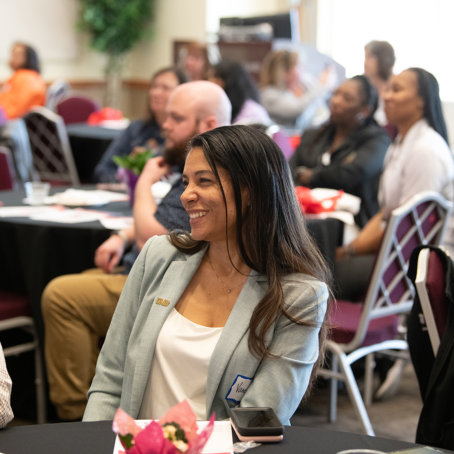 woman sitting in group event