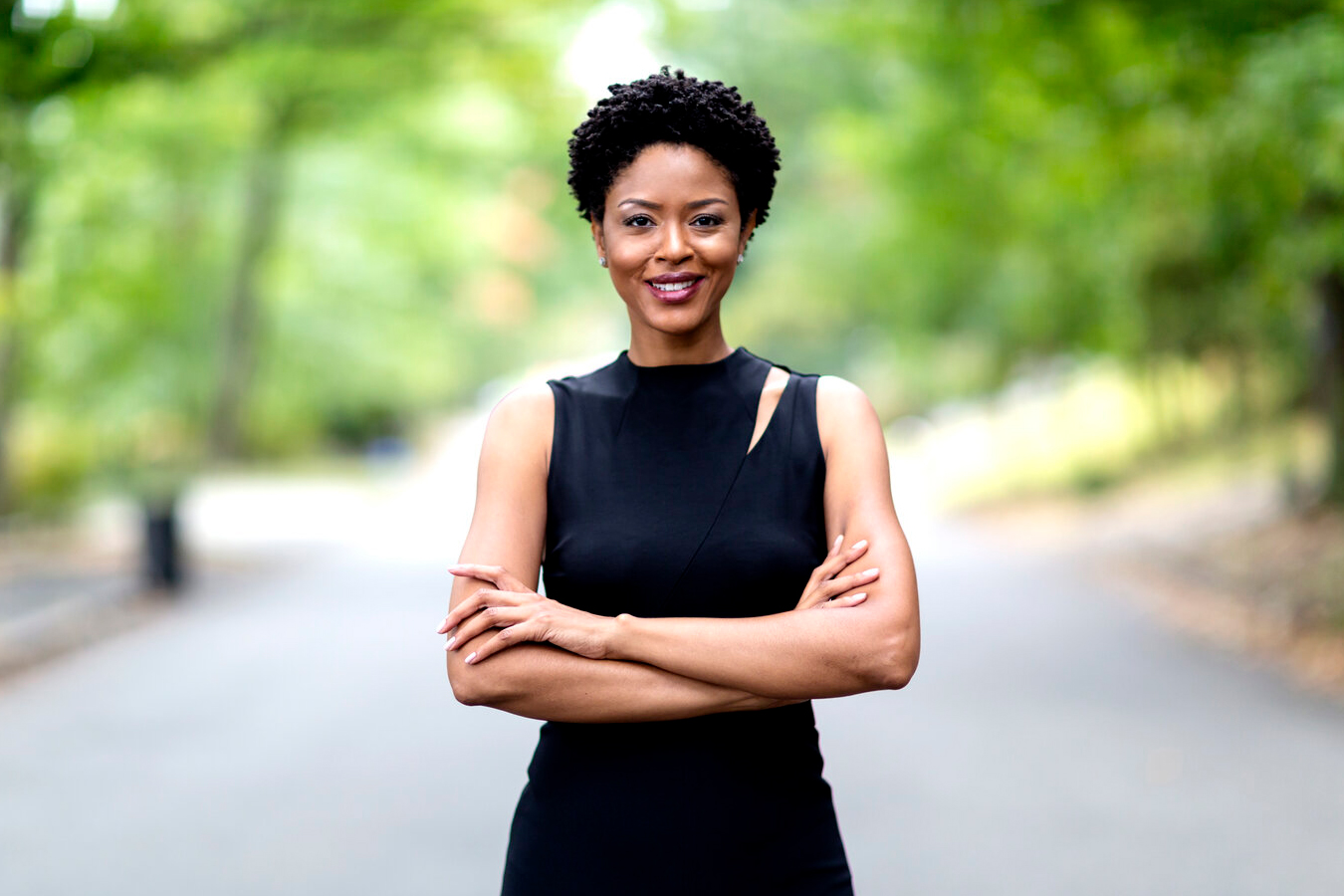 Dr.Pernell with trees behind her