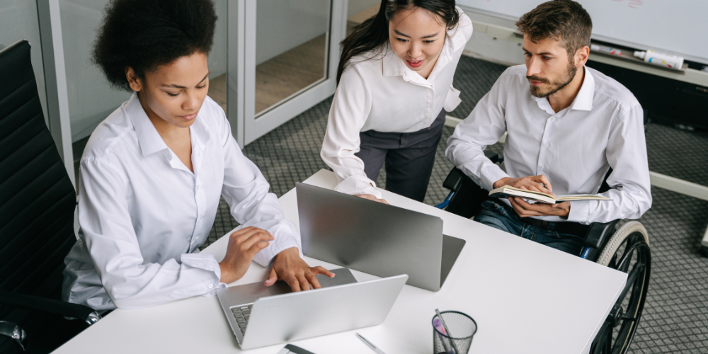 Three people work together