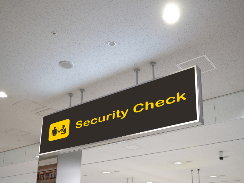 An airport sign reading Security Check