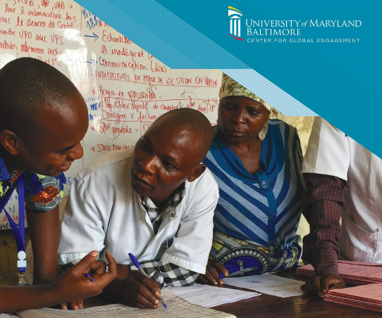 People stand around a table working