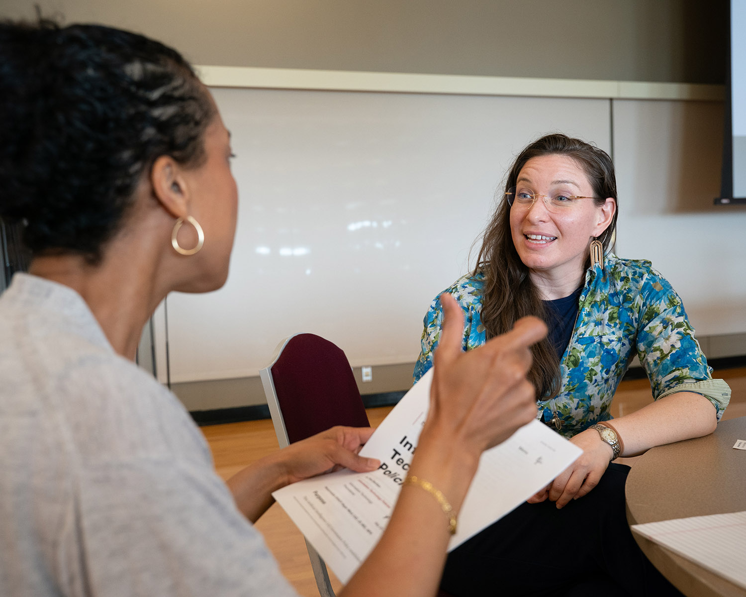 Two People Talking Across a Table