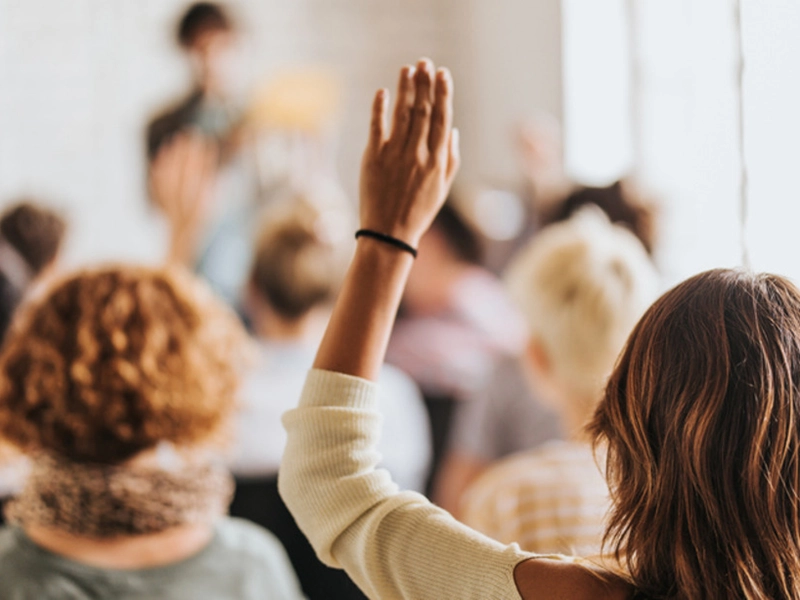 A student raises their hand