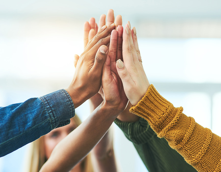 A group of people high fiving