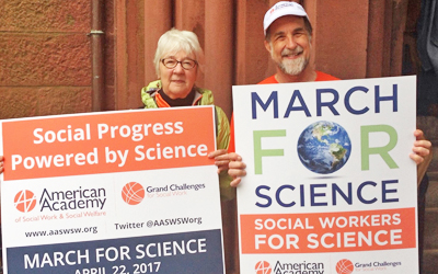 School of Social Work Dean Richard P. Barth, PhD, MSW, and his wife Clinical Professor Nancy Dickinson, MSSW, PhD, with the posters they carried at the March for Science, April 22.