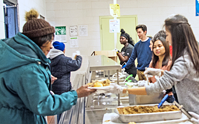 Project Feast volunteers serve Thanksgiving meals to guests on Nov. 22, 2018.