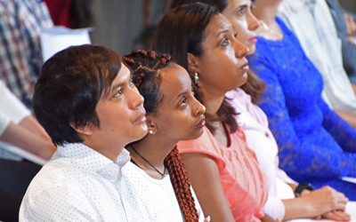 Applicants await cue to take the oath during a U.S. Citizenship and Immigration Services naturalization ceremony at Westminster Hall on June 18, 2018.