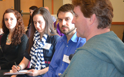 Students from the schools of Dentistry, Nursing, and Pharmacy assess the needs of a standardized patient on IPE Day.