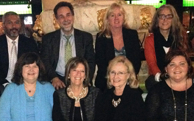 Some of those gathered to launch the National Adoption Competency Mental Health Training Initiative include, left to right, back row, Devon Brooks; Richard P. Barth; Leslie Savary; and Meredith Waudby; front row, Susan Livingston Smith; Debbie Riley; Anne Atkinson; and Marlene Matarese. 