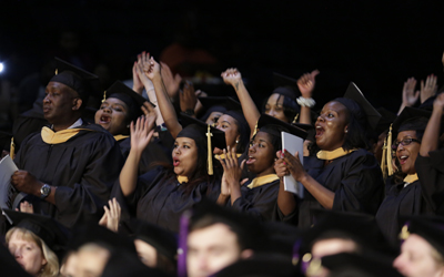 Students celebrate at UMB Commencement 2015.