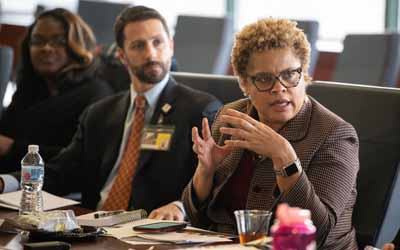 The President's Council for Women at the University of Maryland, Baltimore discuss and vote on the subcommittees in their bylaws. 