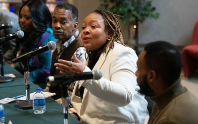 Iman Freeman, Baltimore Action Legal Team, addresses the audience at Westminster Hall.