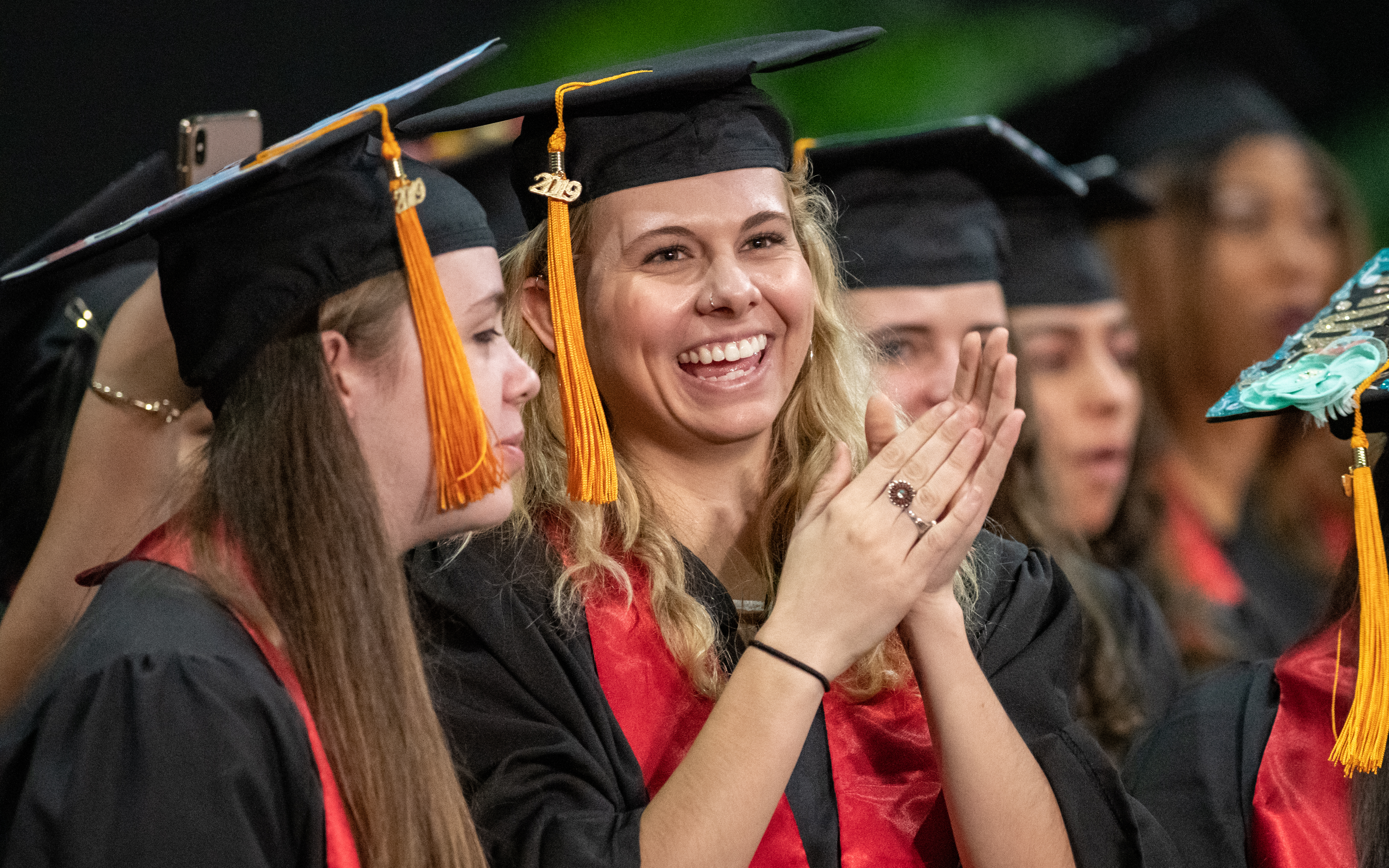 The graduating students of the University of Maryland, Baltimore applaud each other's accomplishments at the 2019 universitywide commencement ceremony.