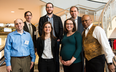 C. Daniel Mullins, PhD (top left), Taylor Woehl, PhD (top center), Marc Taraban, PhD (top right), Christopher Jewell, PhD (bottom left), Jessica Magidson, PhD (bottom center), Kelly Doran, PhD, RN (bottom center), Stephen Thomas, PhD (bottom right), celebrate after presenting their research at the UMB-UMCP Seed Grant Symposium.
