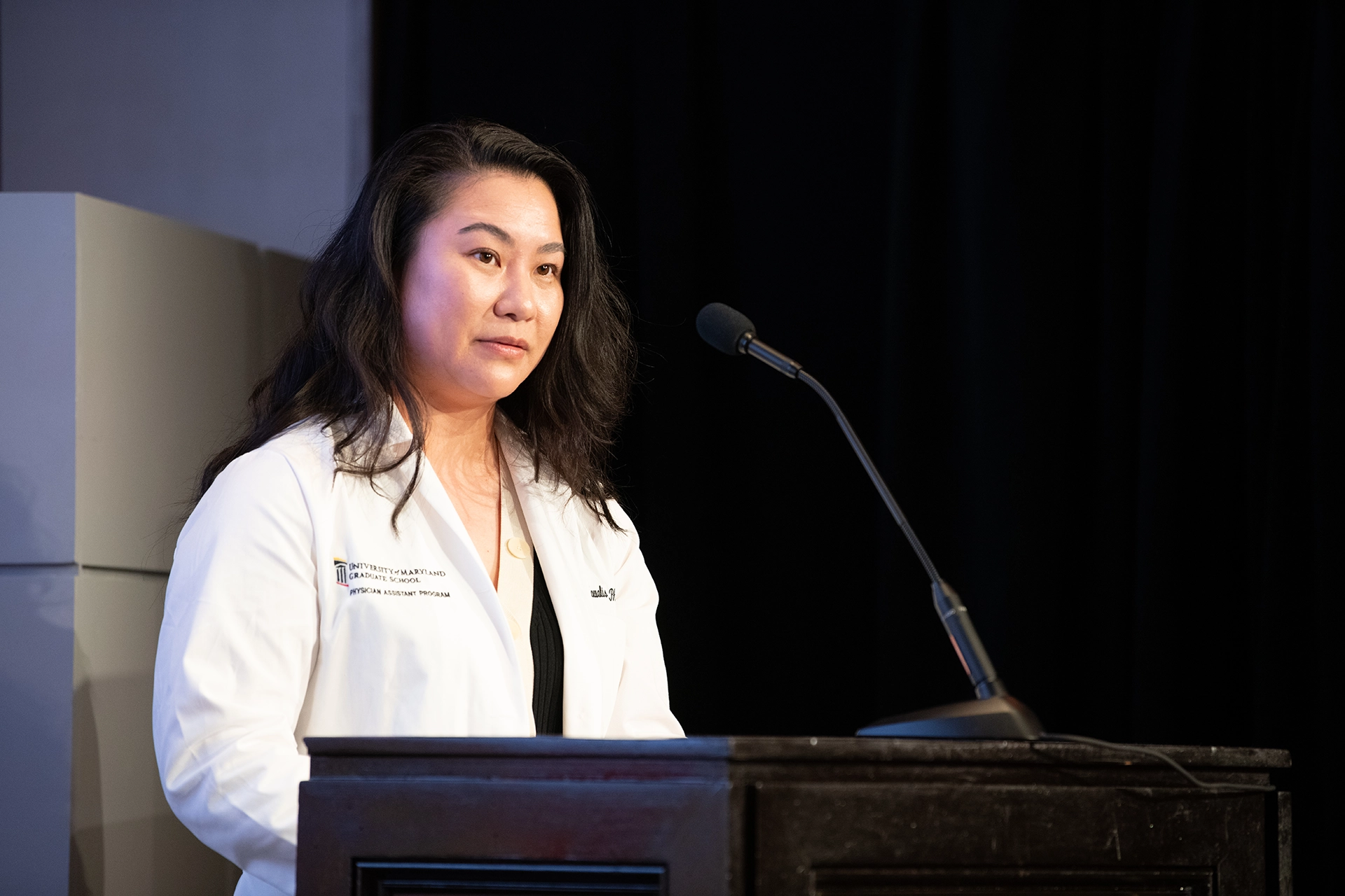 PA speaking at a podium