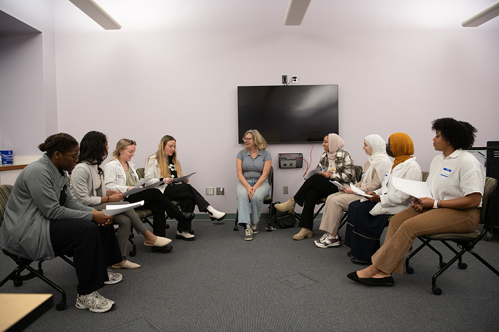 Students and Professor in conversation