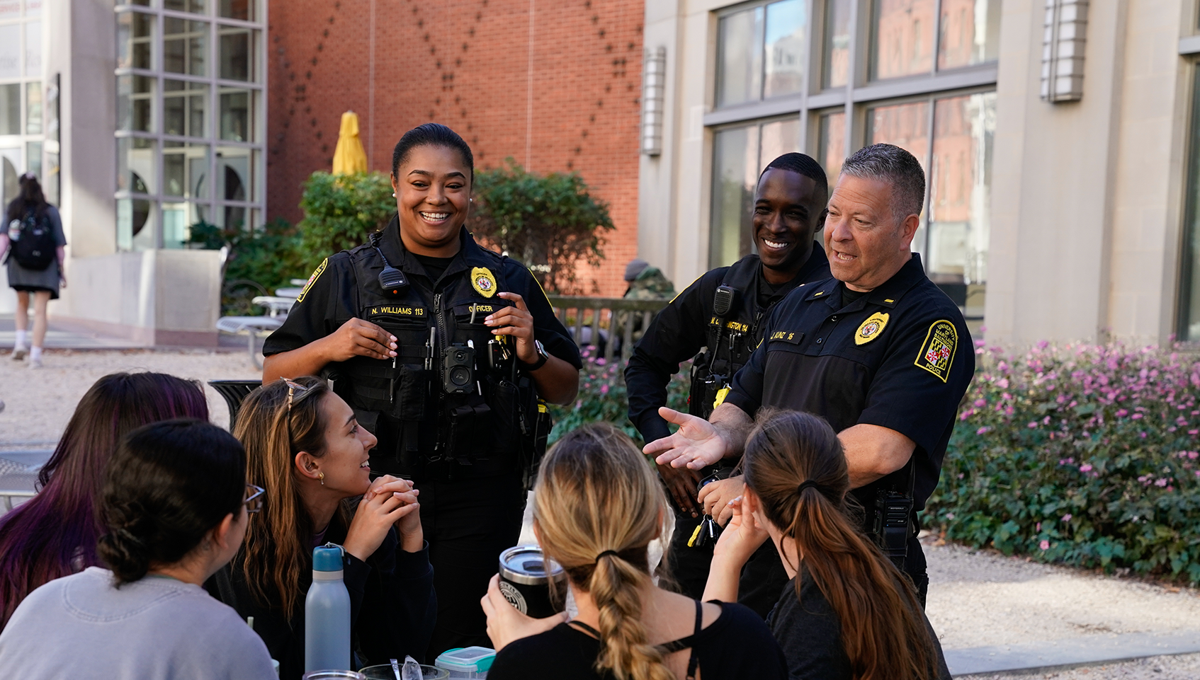 Police officers talking to students