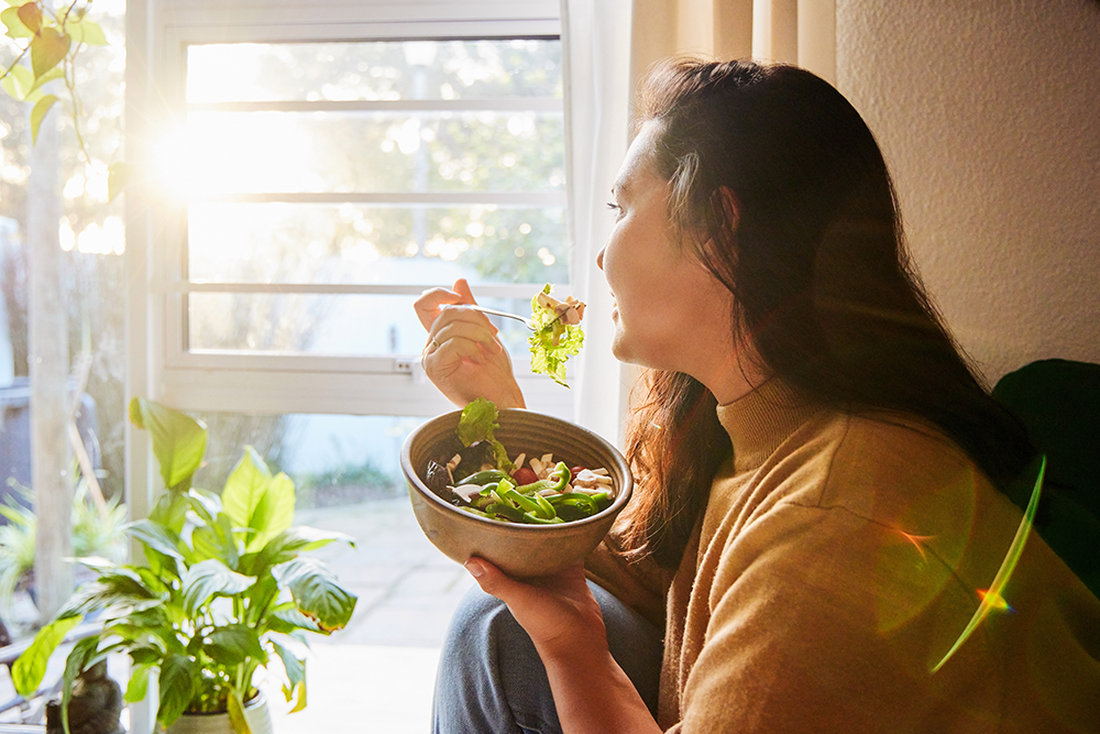 person eating a salad