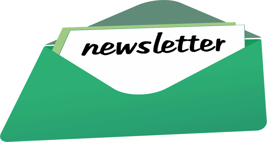Image of an open envelope with a piece of paper that has the word "newsletter" written on it.